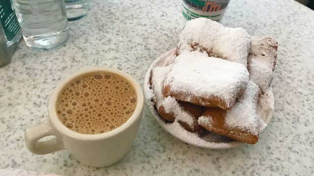 Beignets and coffee at Cafe du Monde in New Orleans