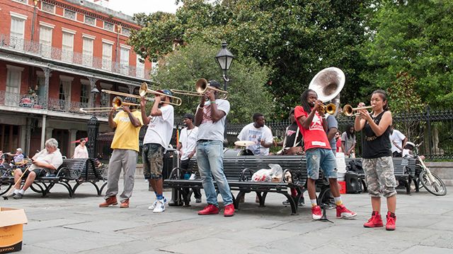 A brass band playing in a square in New Orleans