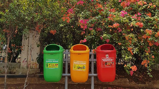 green, yellow, and red recycle bins